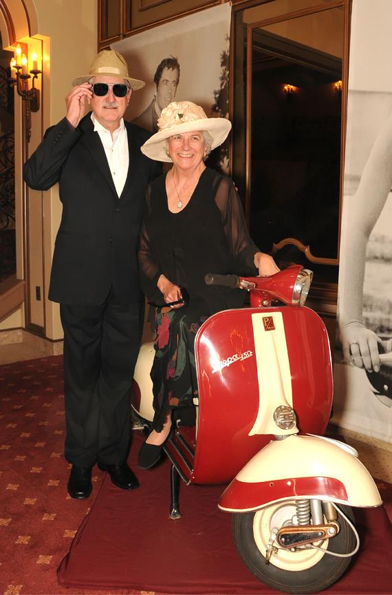 Duncan and Suzanne Mellichamp pose with a Vespa at a ''La Dolce Vita'' opera fundraiser. Photo courtesy of Opera Santa Barbara