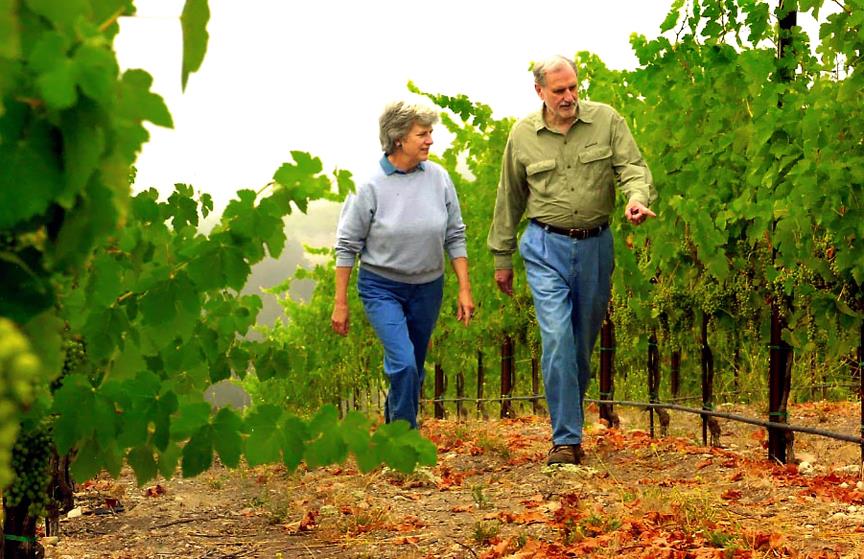 Suzanne and Duncan Mellichamp stroll the vineyard they co-owned in the 1990s.