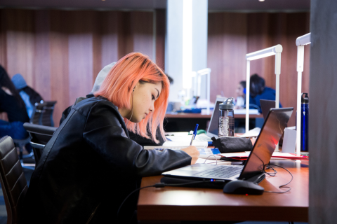 Woman studying in the library